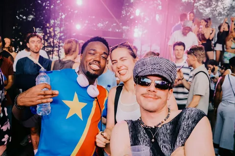 Three friends at a music festival, with green face search brackets
